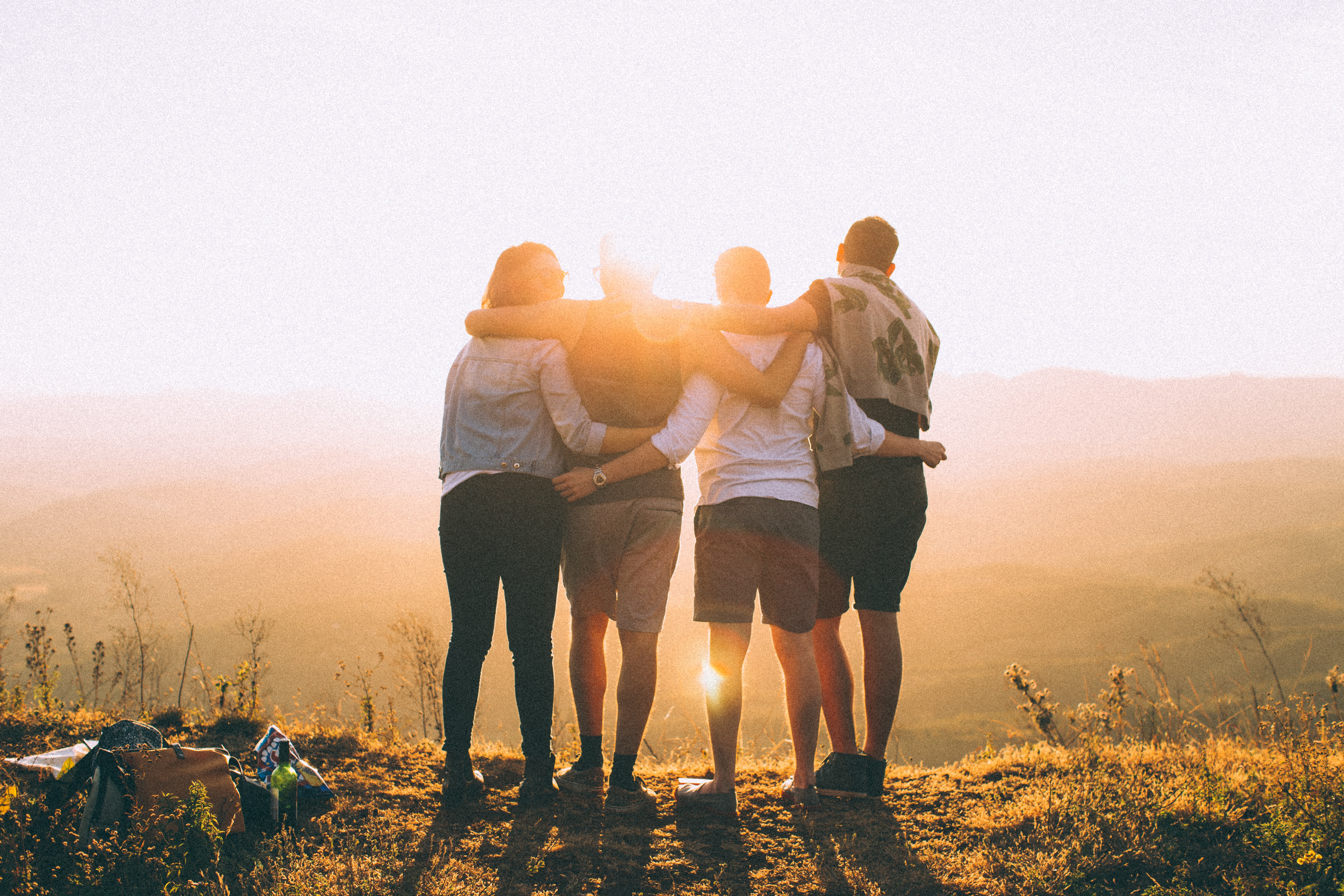 Four Friends Viewing the Sunset by Photo by Helena Lopes on Unsplash