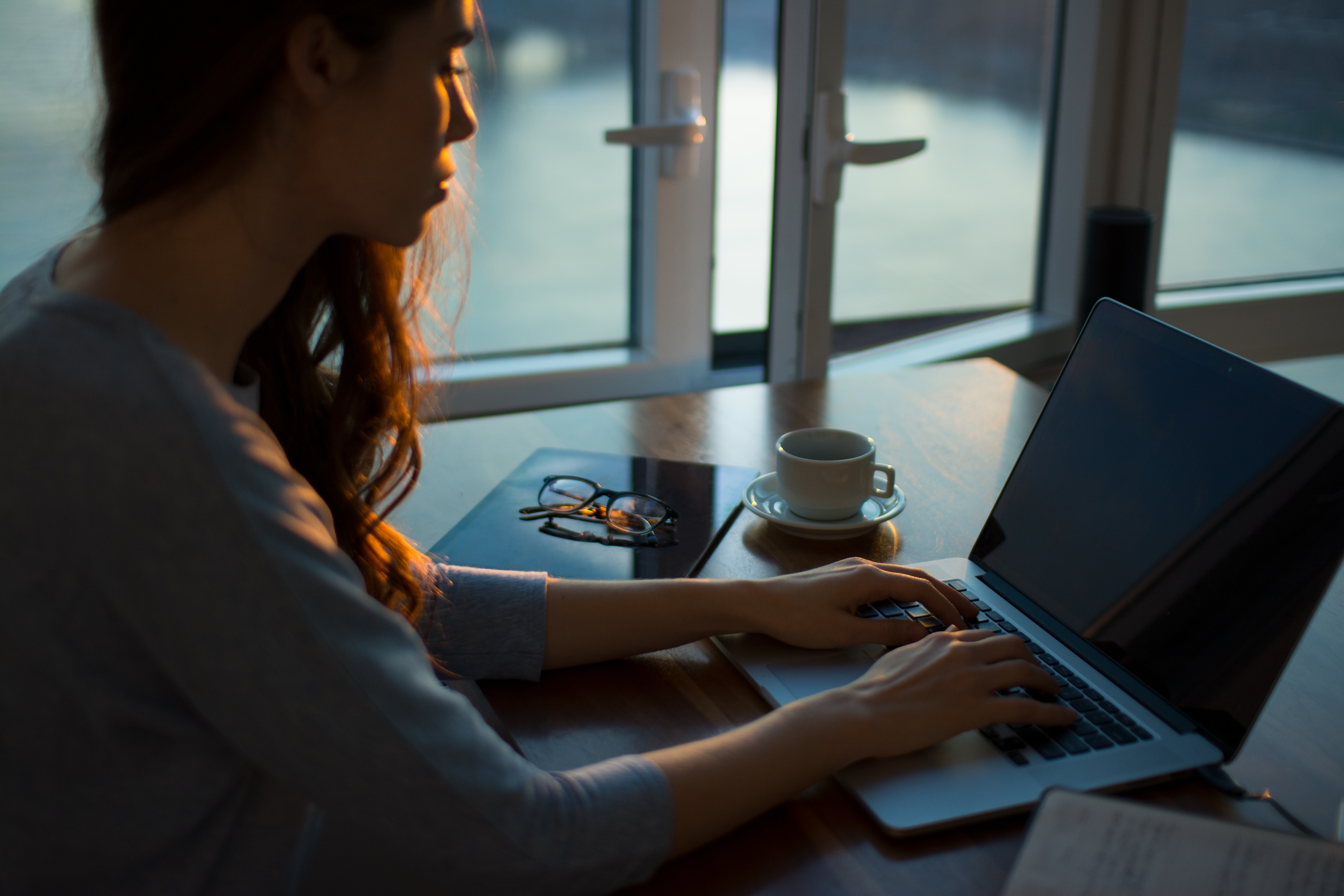 Women Using Laptop at Table - Photo by Thought Catalog on Unsplash